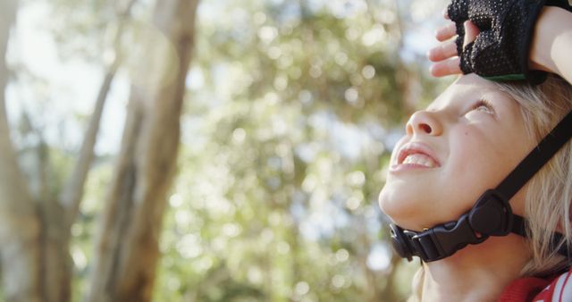 Happy Child Wearing Helmet Outdoors on a Sunny Day - Download Free Stock Images Pikwizard.com