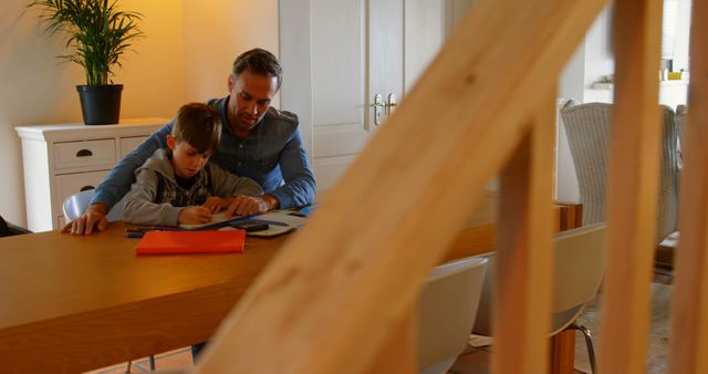 Father Helping Son with Homework in Cozy Home - Download Free Stock Images Pikwizard.com