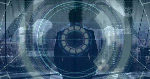 Businessman surrounded by high-tech digital data interface