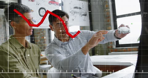 Business Professionals Analyzing Market Trends with Digital Graphs