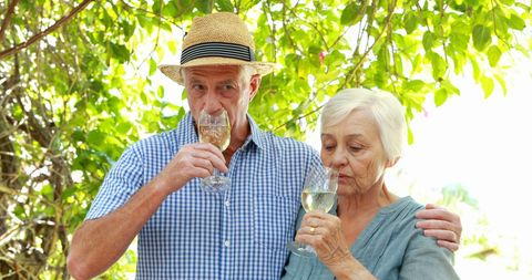 Senior Couple Relaxing with Wine in Garden - Download Free Stock Images Pikwizard.com