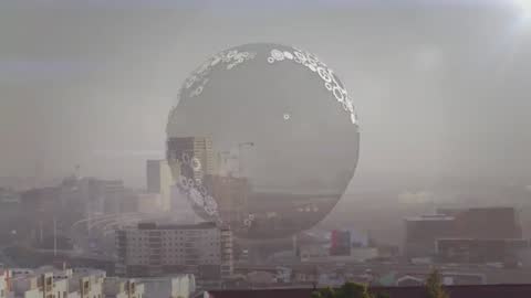 Futuristic Sphere Hovering Over Modern Urban Cityscape