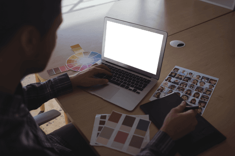 transparent creativity with laptop and color samples on desk - Download Free Stock Videos Pikwizard.com