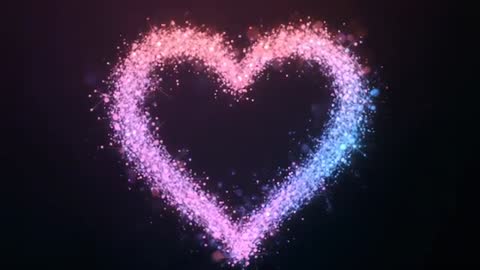 Sparkling Particle Heart Loop with Pink to Blue Glow and Bokeh Sparkles