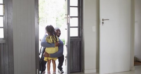 Joyful Father-Daughter Reunion at Home Entrance - Download Free Stock Images Pikwizard.com