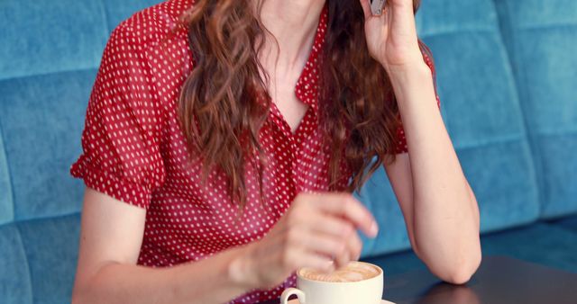 Woman talking on phone while drinking coffee in cafe - Download Free Stock Images Pikwizard.com