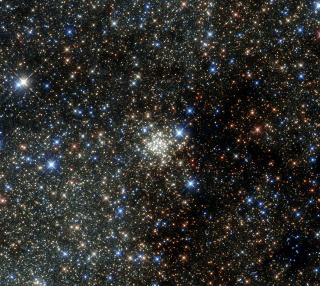 Image shows the densely packed Arches Cluster, located 25,000 light-years away in Sagittarius constellation. Ideal for use in space documentaries, educational materials, and astronomy blogs.
