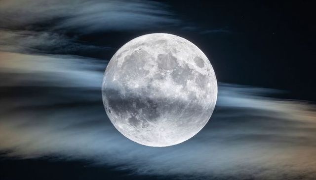 Glowing Full Moon Revealing Craters, Streaking Cirrus Clouds, Soft Halo Night Sky
