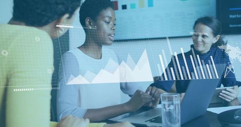 Business team analyzing data with augmented charts in modern office