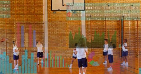 Coaching teacher guiding youth in gym with basketball drill and performance analytics