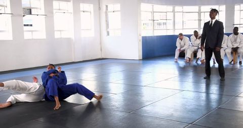 Grappling training session in judo dojo
