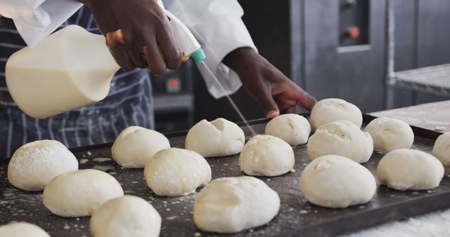 Baker Prepares Fresh Dough Balls With Milk For Baking - Download Free Stock Images Pikwizard.com