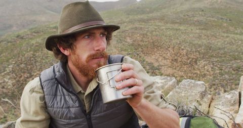 Bearded Man Drinking Water on Mountain Adventure - Download Free Stock Images Pikwizard.com