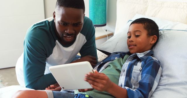 Father and Son Bonding Time with Digital Tablet at Home - Download Free Stock Images Pikwizard.com