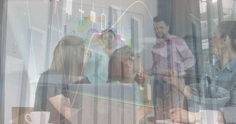 Digital financial graph overlaying team meeting collaboration