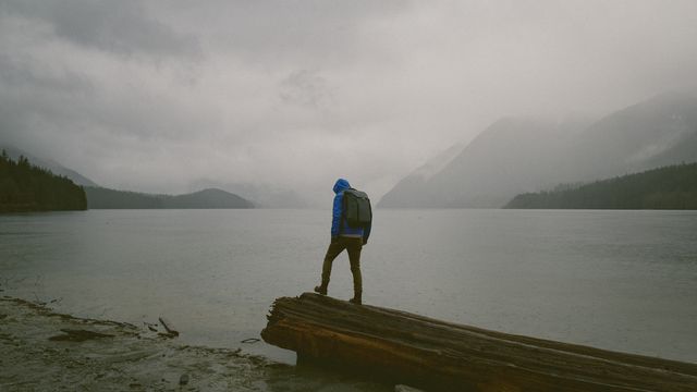 Hiker Contemplating Misty Lake and Mountains - Download Free Stock Images Pikwizard.com