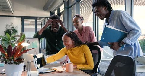 Team Celebrating Success in Modern Office with High-Five