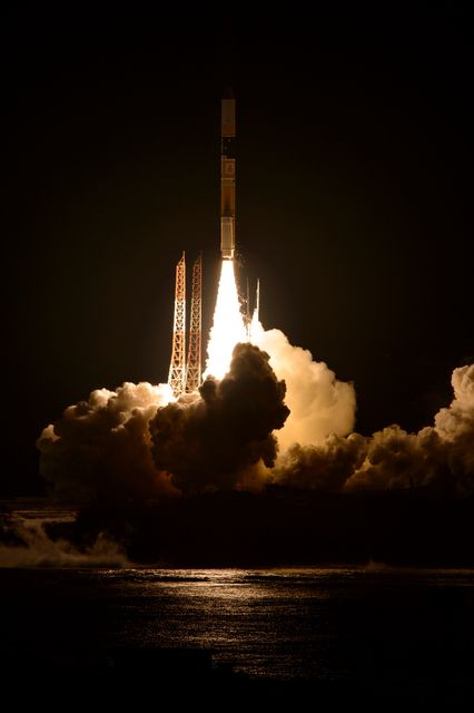 Japanese H-IIA rocket launching from Tanegashima Space Center at night. Perfect for content about space exploration, satellite technology, Japan Aerospace Exploration Agency (JAXA), and NASA missions. Ideal for educational materials, news updates, science articles, and tech blogs.