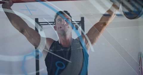 Male Athlete Lifting Barbell Overhead in Squat Rack with Futuristic Blue Data Overlay