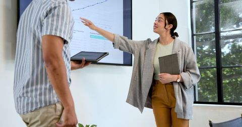 Multiracial Team Analyzing Business Growth in Modern Office