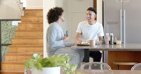 Joyful Morning at Home Kitchen with Friends Sharing Breakfast