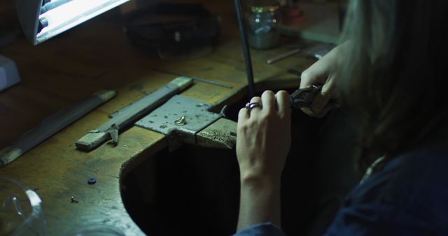 Jeweler Crafting Ring in Workshop Under Lamp Light - Download Free Stock Images Pikwizard.com