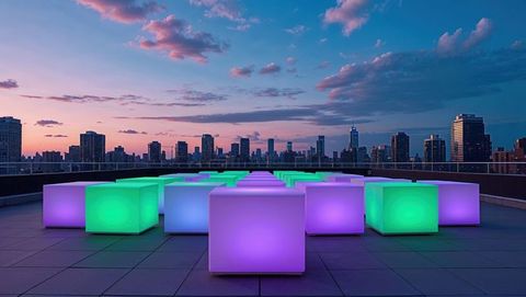 Futuristic neon cubes on rooftop terrace at dusk with urban skyline