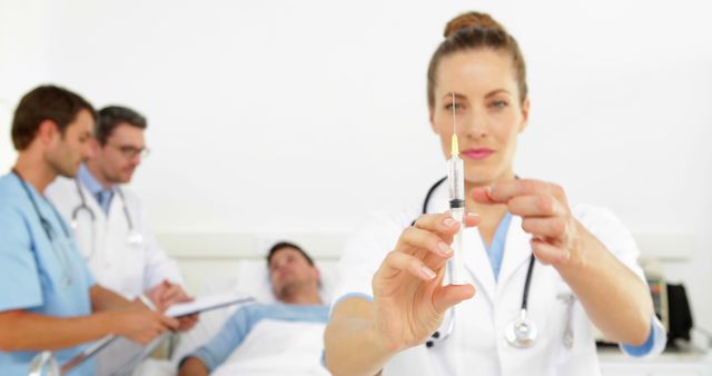 Nurse Preparing Injection with Patients and Doctors in Background - Download Free Stock Images Pikwizard.com