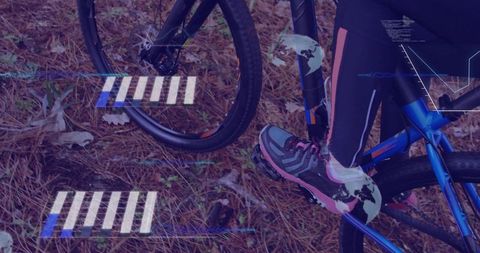 Cyclist balancing on forest trail with futuristic graphics