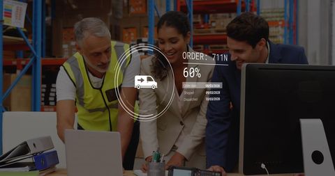 Workers and supervisors collaborating in warehouse with modern data interface