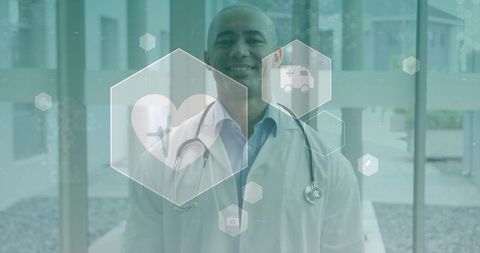 Smiling physician with stethoscope and digital healthcare hexagon interface in modern clinic