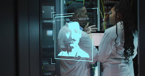 Engineers Managing Server Room with Digital Interface