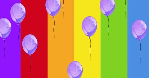 Colorful Balloons Against Bright Rainbow Stripes Celebrating LGBT Pride