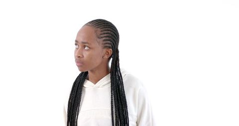 Woman in White Hoodie Looking Thoughtful Against Clean Background