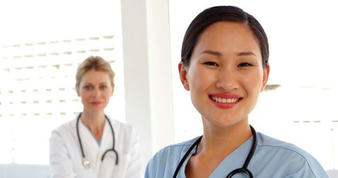 Confident Medical Professionals Smiling in Hospital Setting - Download Free Stock Images Pikwizard.com