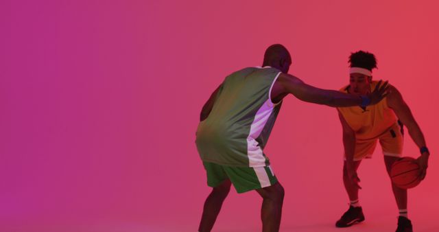 Two basketball players facing off in bright studio - Download Free Stock Images Pikwizard.com