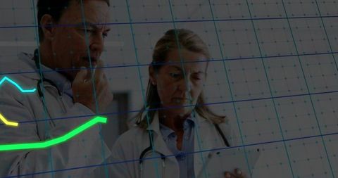 Doctors Analyzing Trends on Tablet in Clinic