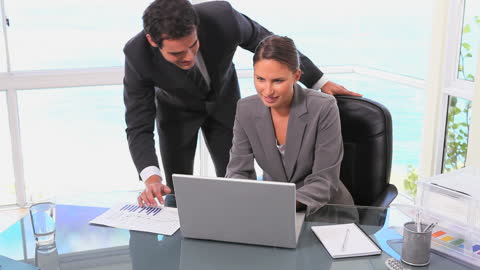 Business Colleagues Collaborating at Office Desk