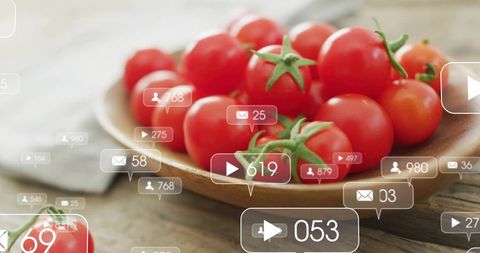 Cherry tomatoes in wooden bowl with social media engagement overlays on rustic table