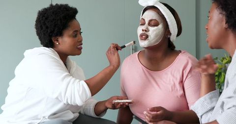 Female Friends Enjoying Facial Masks and Relaxation at Home