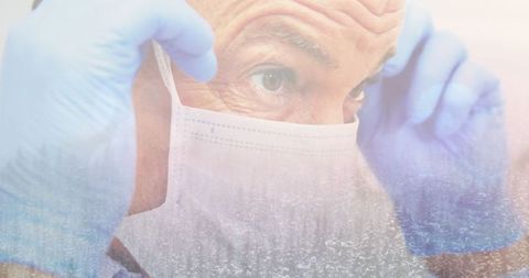 Male Surgeon Wearing a Face Mask with Winter Scene Overlay