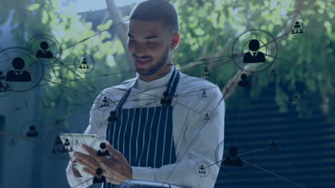 Chef Utilizing Digital Connections on Tablet in Modern Kitchen