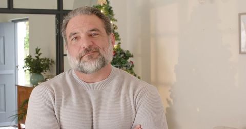Senior man enjoying cozy holiday moment at home