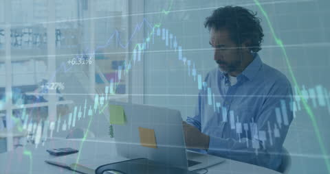 Businessman Analyzing Stock Market Data on Laptop