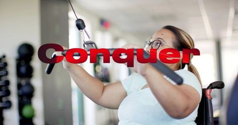 Adaptive strength training pulling lat bar woman in wheelchair wearing glasses conquer
