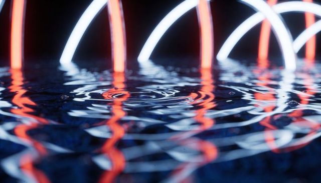 Neon arcs reflecting on rippling water surface creating concentric droplet rings and glow