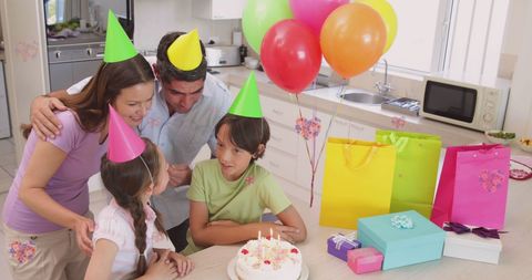 Joyful Family Birthday Celebration with Cake and Balloons - Download Free Stock Images Pikwizard.com