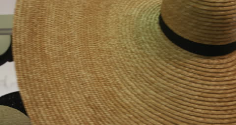 Close-Up View of Straw Hat Display in Factory Showroom
