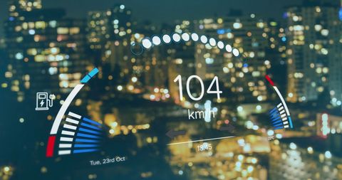 Digital speedometer display overlaying cityscape at night