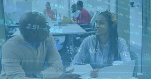 Professionals Discussing Market Trends with Data Overlay in Modern Office